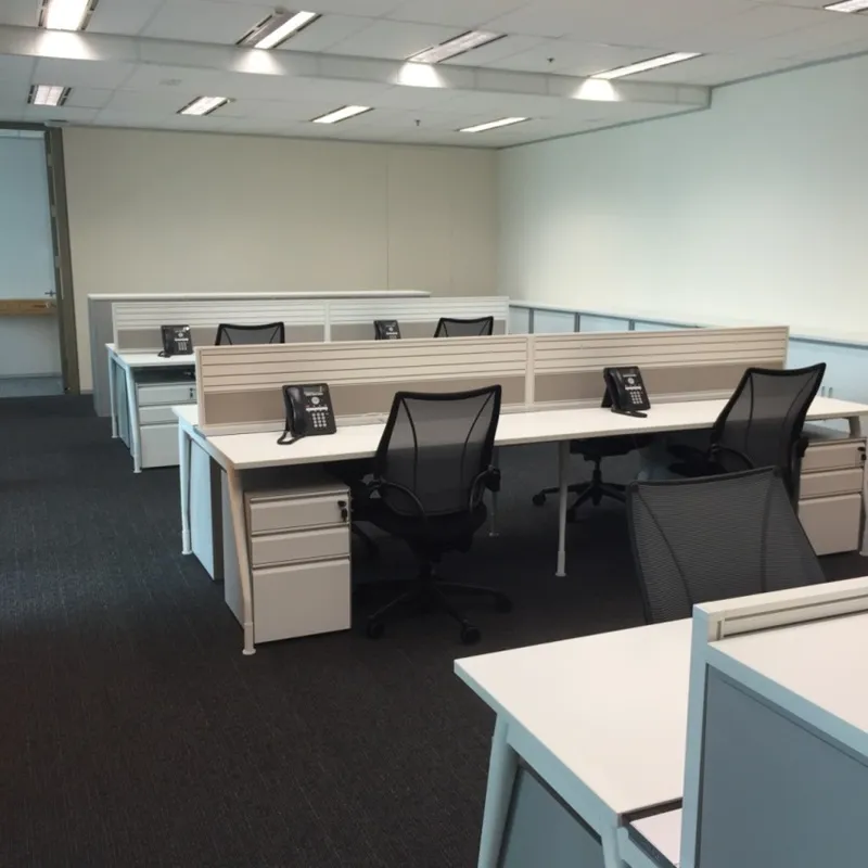 Open-plan office with IP phones installed at each workstation