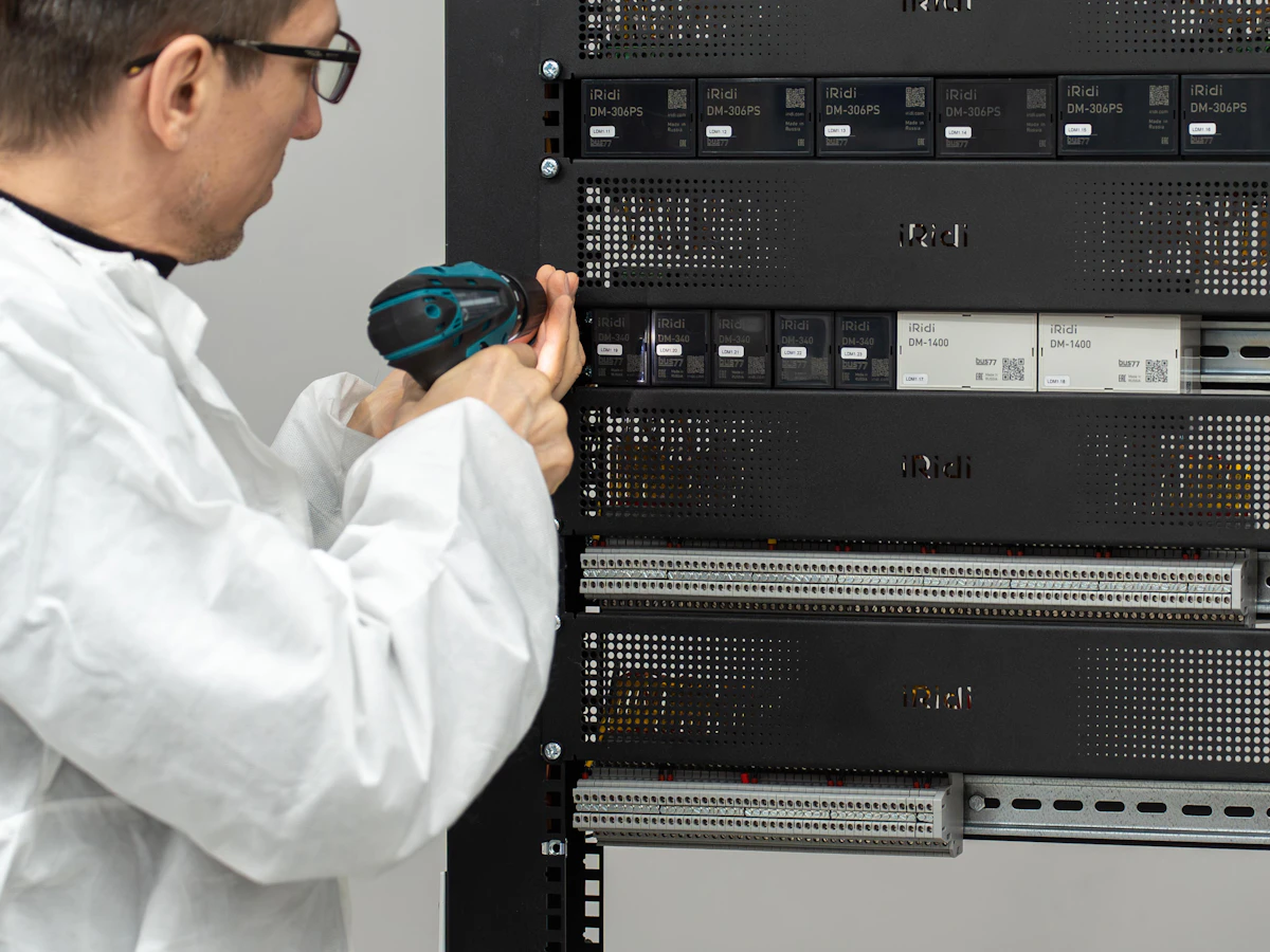 Technician fitting equipment into a rack