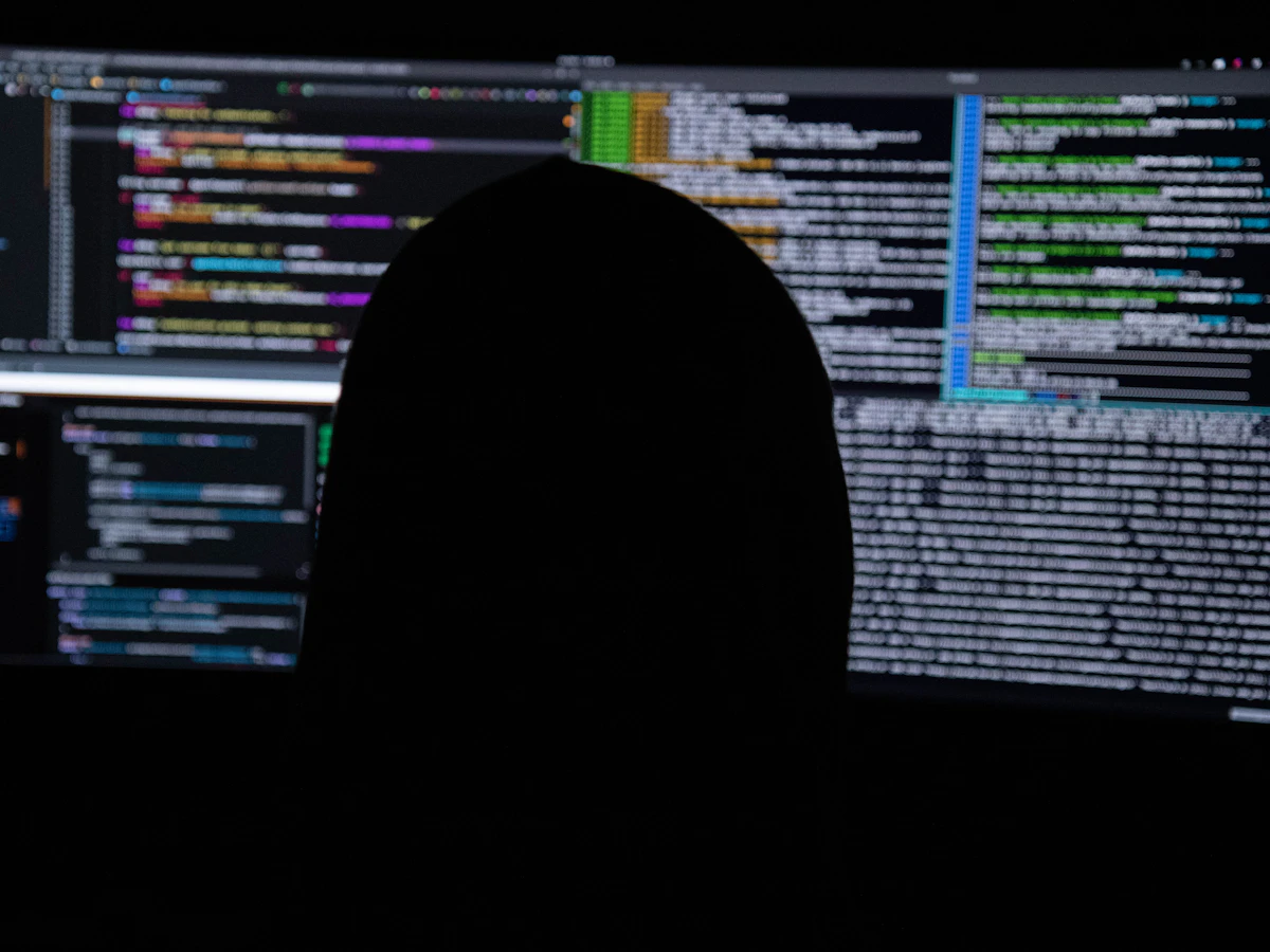 Person monitoring code and system logs on several screens